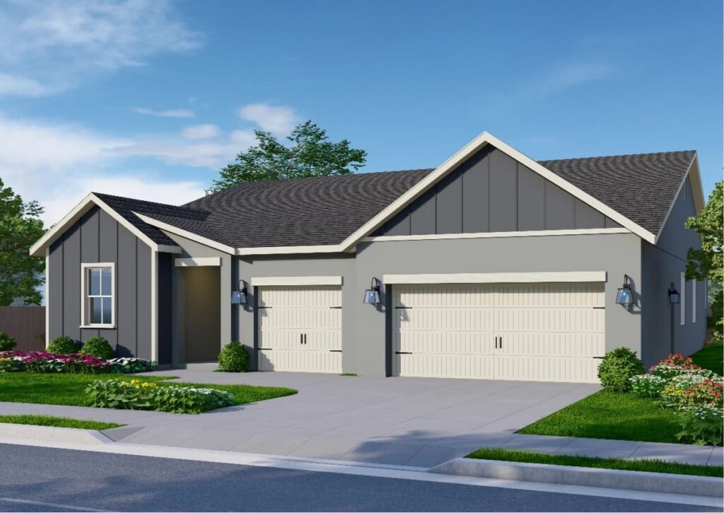 A one-story home with a farmhouse-inspired design. The exterior features light gray walls with contrasting white trim. Dark gray paneling surrounds the front window and extends to the gable end above the double garage door. The garage doors are white with rustic paneling accents, and the home includes a three-car garage—one single and one double garage door.